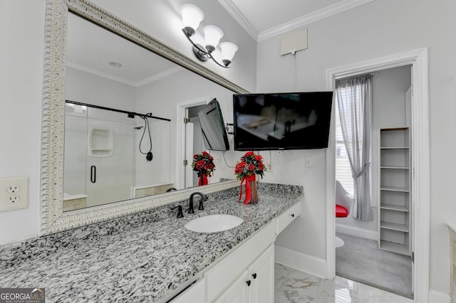 bathroom featuring vanity, baseboards, a shower stall, crown molding, and marble finish floor