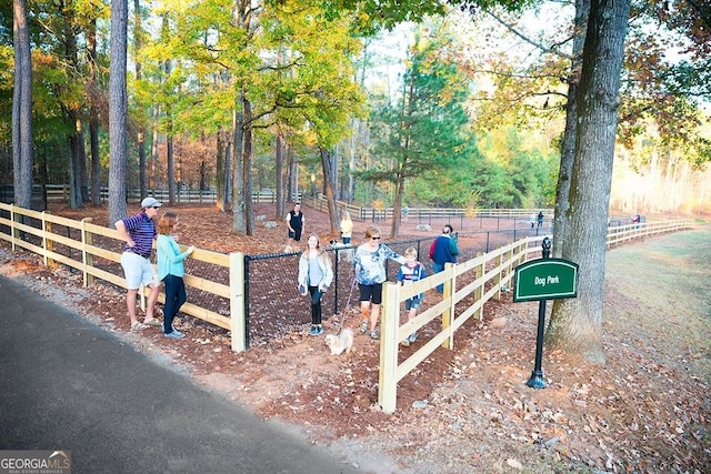 view of community featuring fence