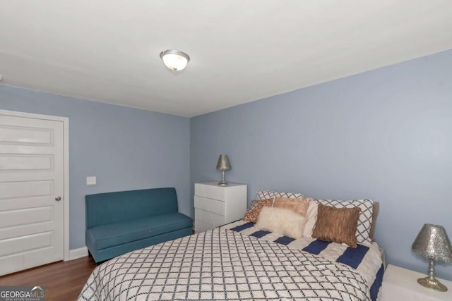 bedroom with wood finished floors