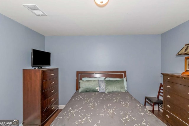 unfurnished bedroom featuring visible vents