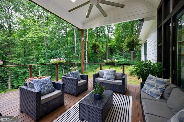 deck featuring an outdoor living space and ceiling fan