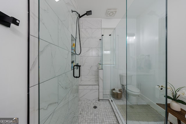 full bath with toilet and a stall shower