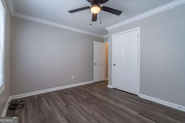 unfurnished bedroom with baseboards, wood finished floors, a ceiling fan, and ornamental molding