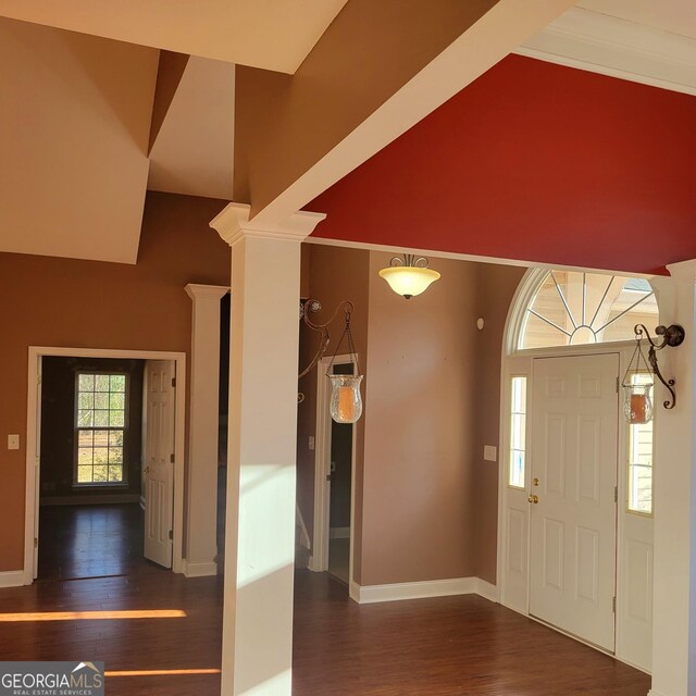 empty room with baseboards, wood finished floors, visible vents, and ceiling fan