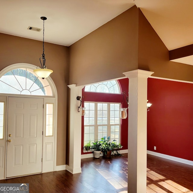 unfurnished living room featuring wood finished floors, a fireplace, visible vents, and french doors