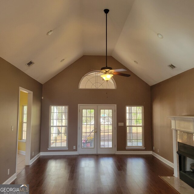 kitchen featuring brown cabinetry, custom exhaust hood, glass insert cabinets, gas range, and backsplash