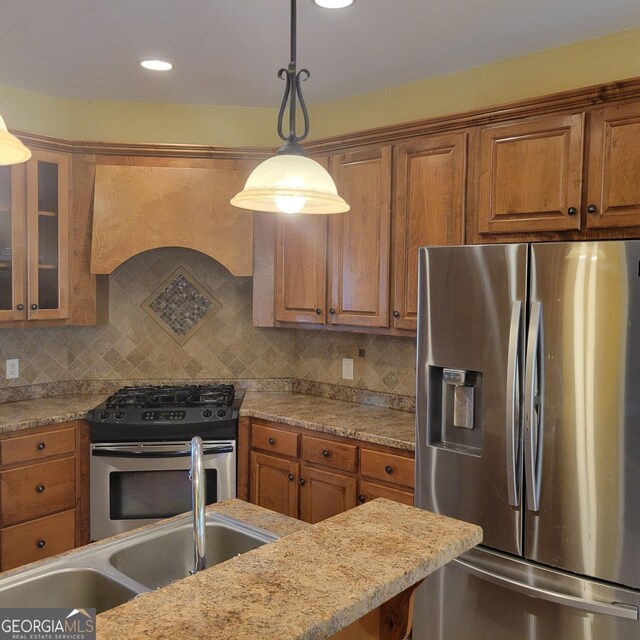 kitchen with dark countertops, visible vents, a healthy amount of sunlight, and a sink