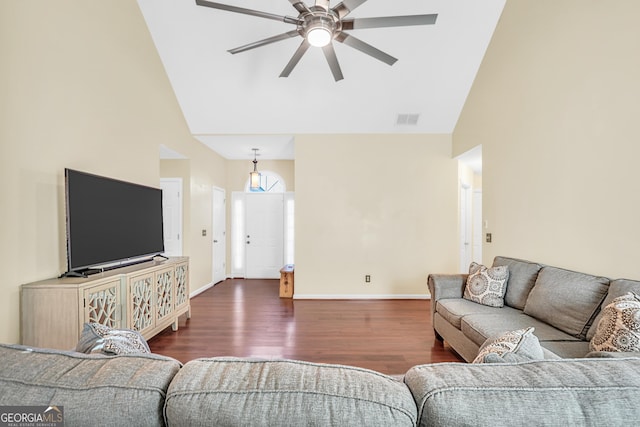 living room with a ceiling fan, wood finished floors, visible vents, high vaulted ceiling, and baseboards