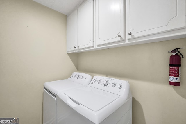 laundry area featuring cabinet space and independent washer and dryer