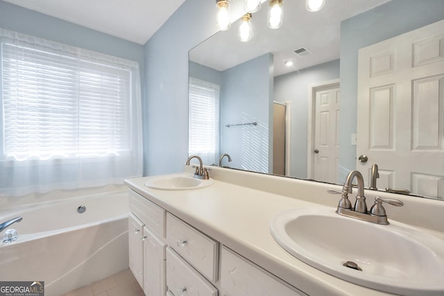 full bath with tile patterned flooring, visible vents, a bath, and a sink