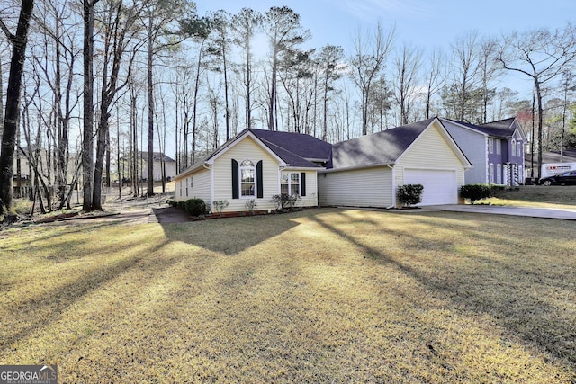 ranch-style home with a garage and a front lawn