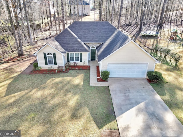 ranch-style house with driveway, an attached garage, a front lawn, and roof with shingles