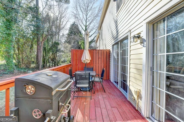 wooden terrace with area for grilling