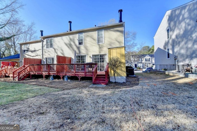 back of property featuring a deck