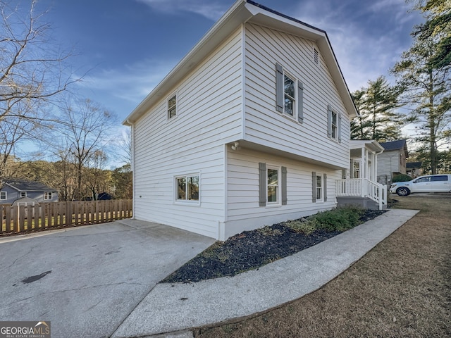 view of property exterior featuring fence