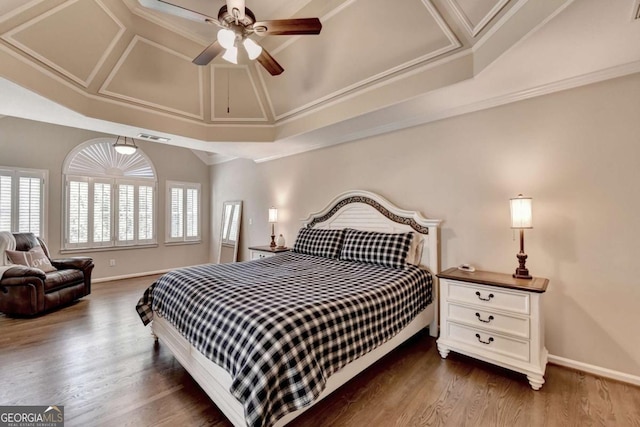 bedroom with visible vents, baseboards, dark wood-type flooring, and crown molding