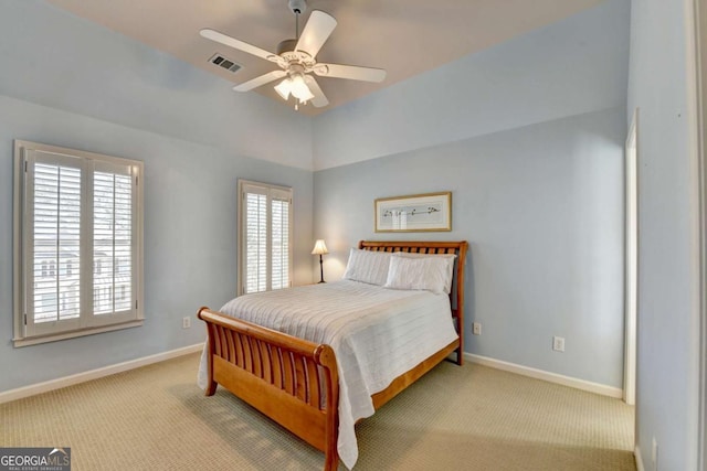 bedroom featuring carpet flooring, baseboards, visible vents, and a ceiling fan