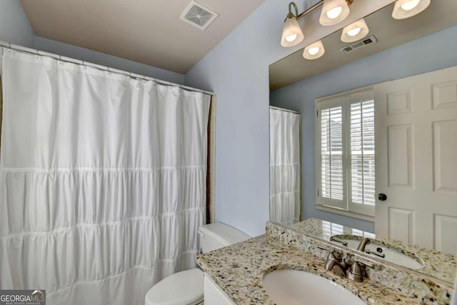 full bathroom with a shower with shower curtain, visible vents, toilet, and vanity