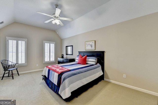 bedroom with visible vents, lofted ceiling, carpet, and baseboards