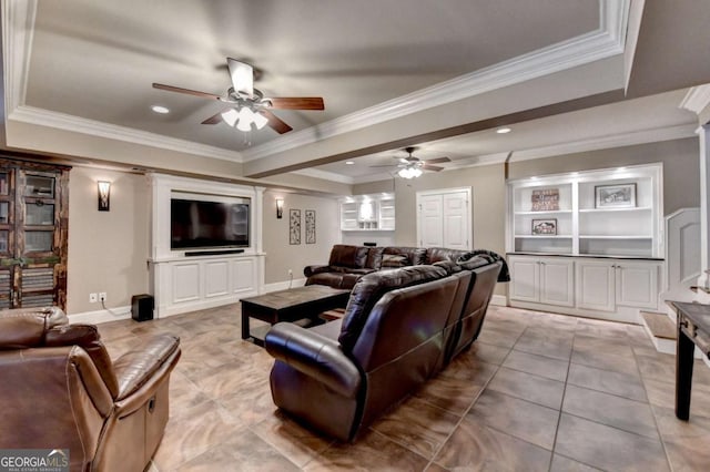 living room with tile patterned flooring, crown molding, baseboards, and ceiling fan