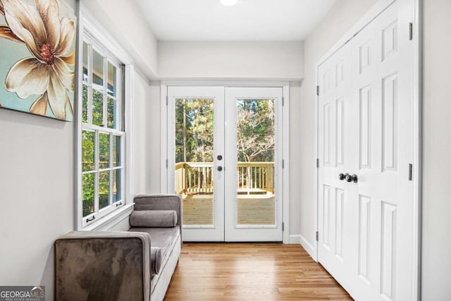 entryway with french doors and wood finished floors