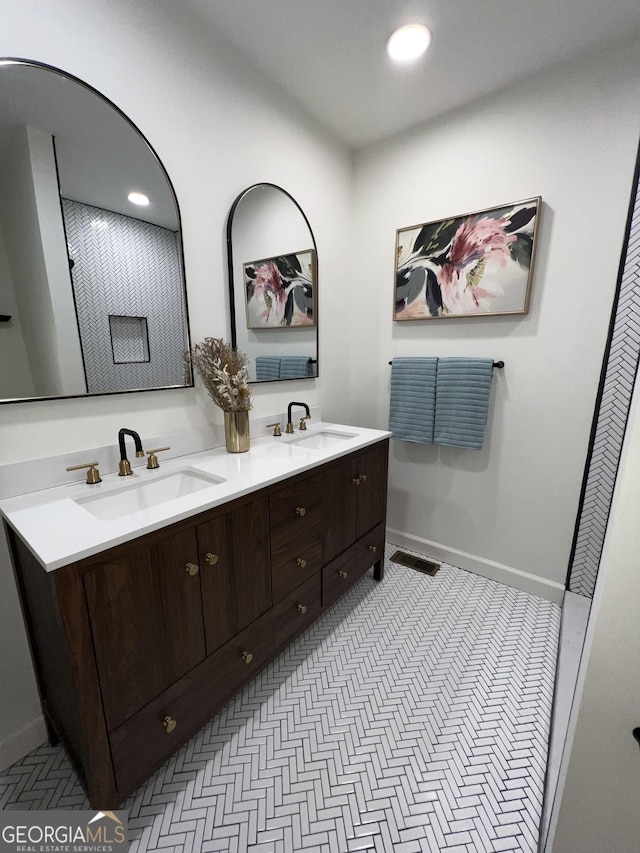 full bathroom with double vanity, visible vents, recessed lighting, and a sink