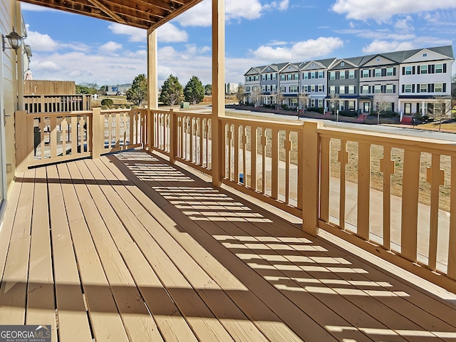 wooden deck with a residential view