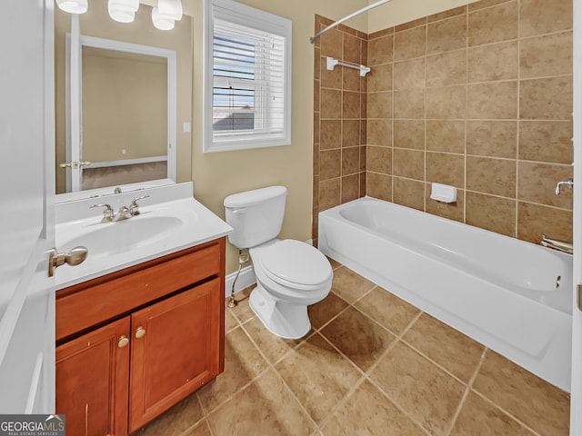 full bath with vanity, baseboards, tile patterned flooring, shower / tub combination, and toilet