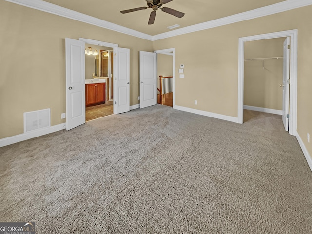 unfurnished bedroom with light carpet, visible vents, baseboards, and ornamental molding