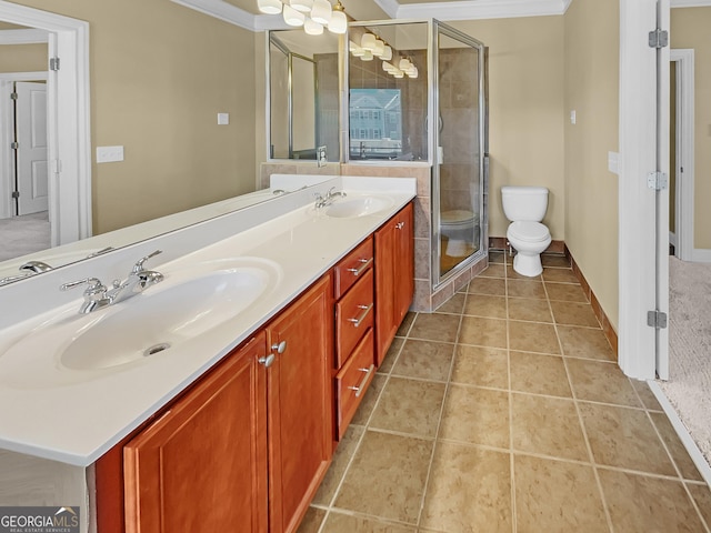 full bath with tile patterned flooring, ornamental molding, toilet, and a sink