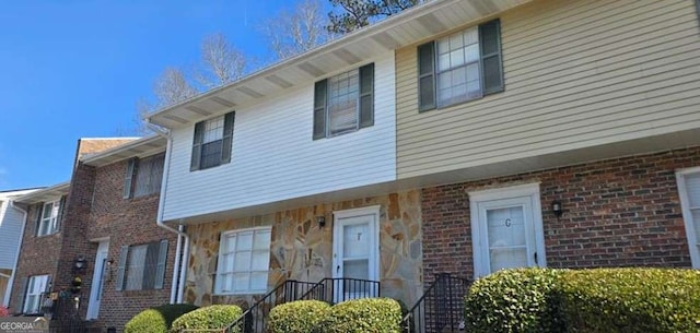 view of property with brick siding