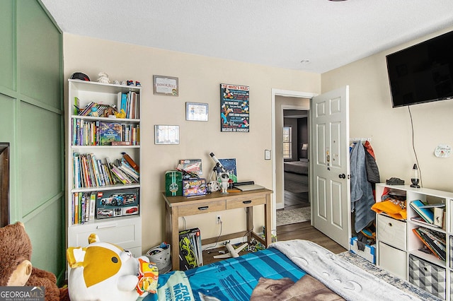 bedroom featuring wood finished floors