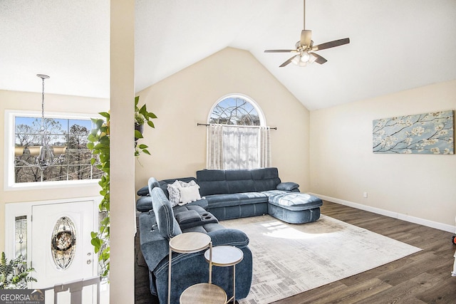 living room featuring high vaulted ceiling, a ceiling fan, baseboards, and wood finished floors