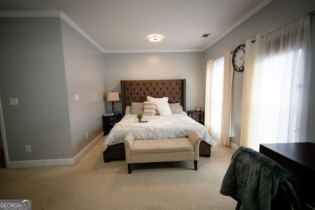 bedroom with visible vents, baseboards, carpet, and crown molding