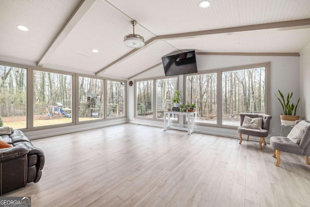 sunroom / solarium with lofted ceiling with beams