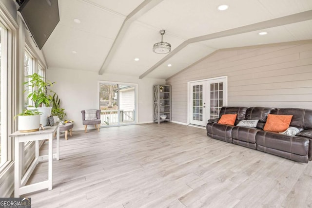 sunroom with french doors and lofted ceiling