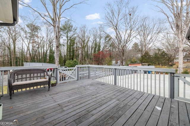 wooden terrace with an outbuilding