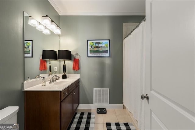 bathroom featuring visible vents, toilet, tile patterned flooring, baseboards, and vanity