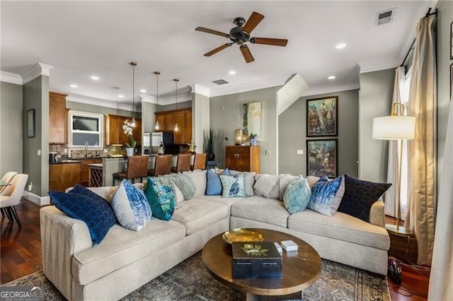 living room with recessed lighting, dark wood-style floors, visible vents, and ornamental molding