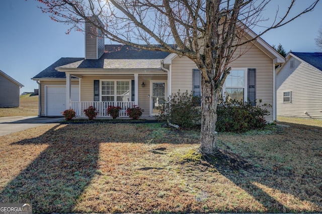 view of front facade featuring covered porch, a shingled roof, a chimney, concrete driveway, and a garage