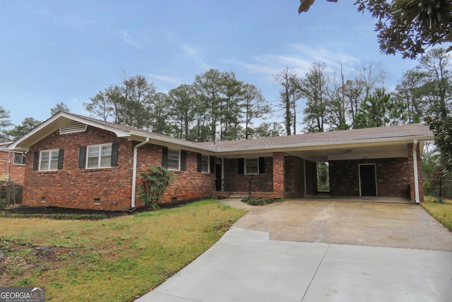 ranch-style home featuring brick siding, an attached carport, a front lawn, crawl space, and driveway