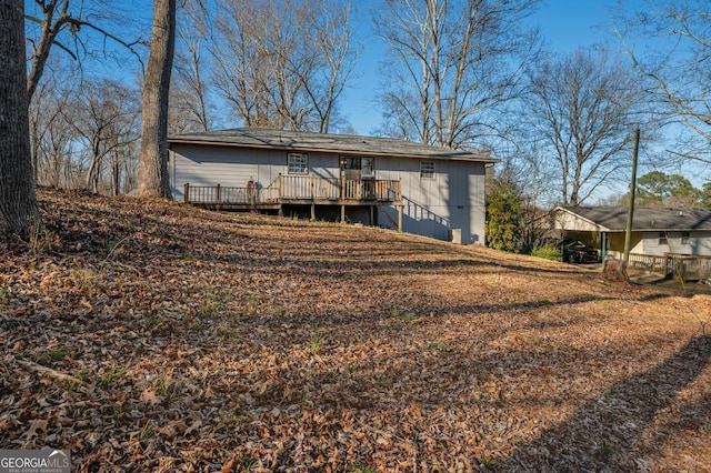 rear view of property with a deck