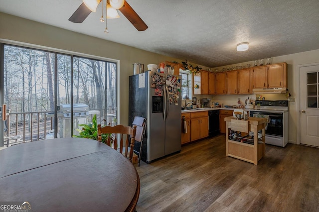 kitchen with under cabinet range hood, light countertops, black dishwasher, range with electric stovetop, and stainless steel refrigerator with ice dispenser