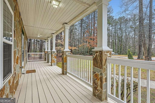 wooden terrace with a porch