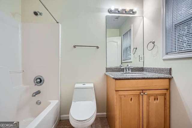 bathroom featuring vanity, shower / tub combination, toilet, and baseboards