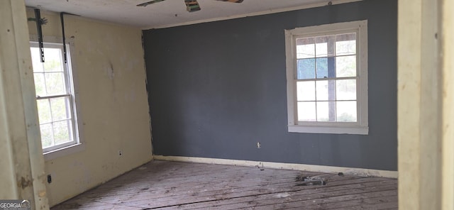 unfurnished room featuring hardwood / wood-style floors and ceiling fan