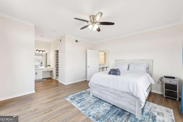 bedroom featuring a ceiling fan, wood finished floors, baseboards, visible vents, and crown molding