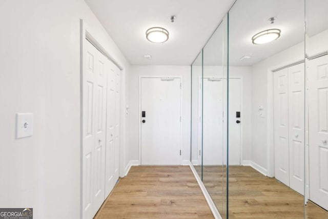 hallway featuring light wood finished floors