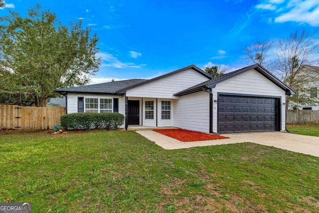 single story home featuring driveway, a front yard, a garage, and fence