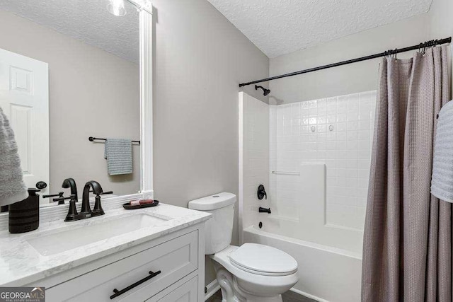 bathroom featuring shower / bathtub combination with curtain, toilet, vanity, and a textured ceiling